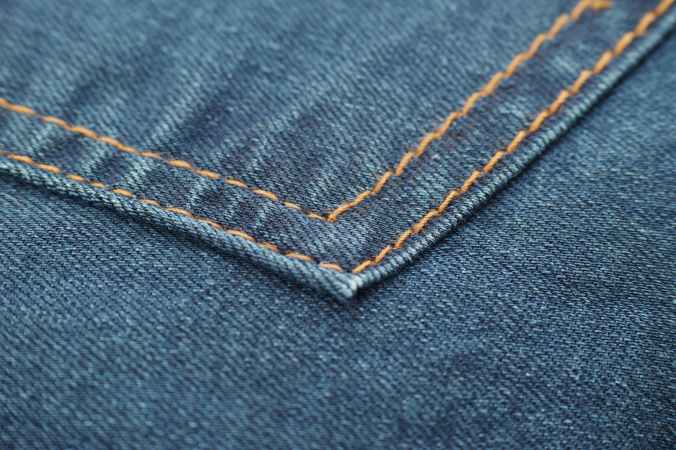 photo of blue denim textile