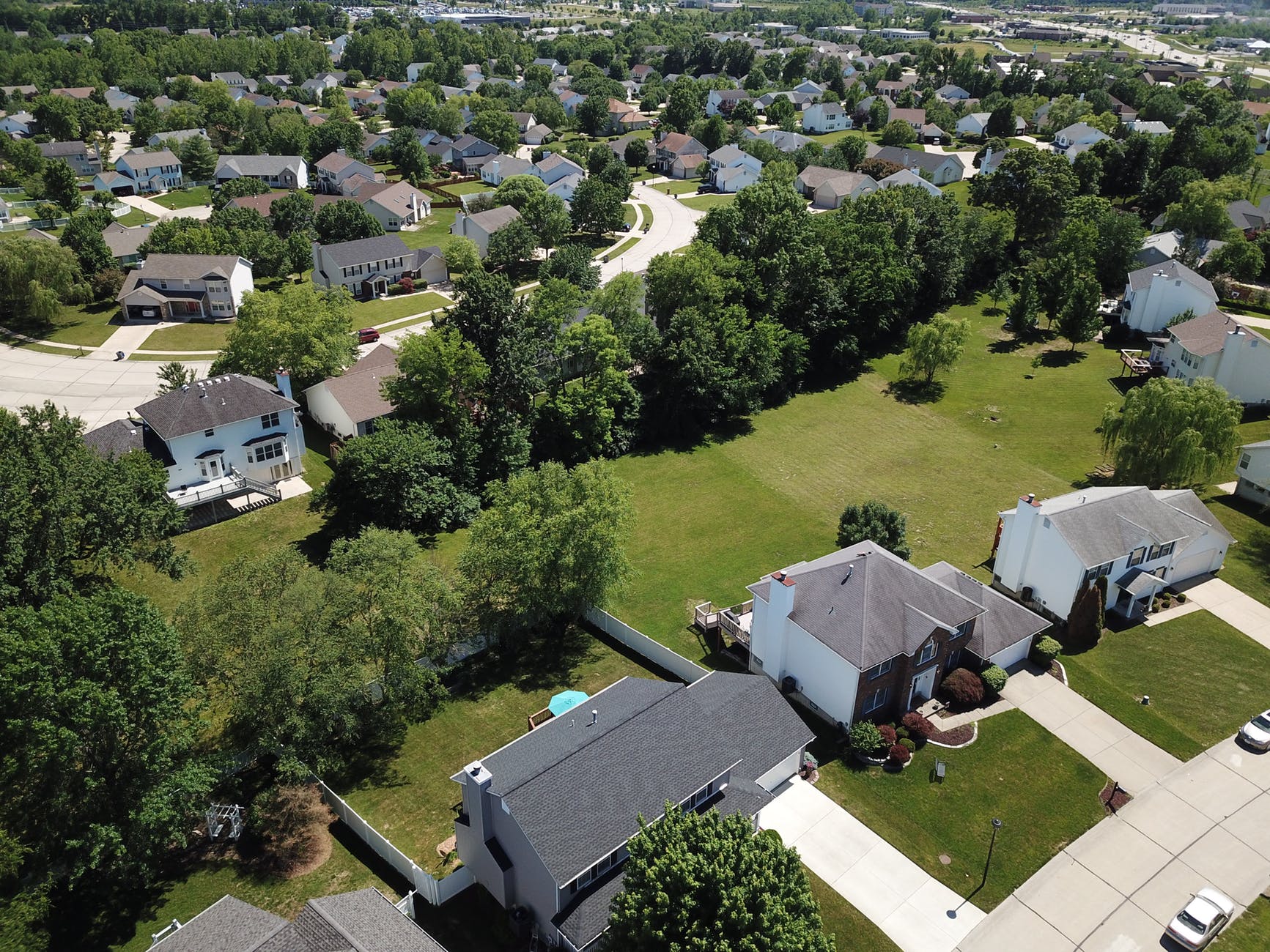 aerial photography of houses and trees