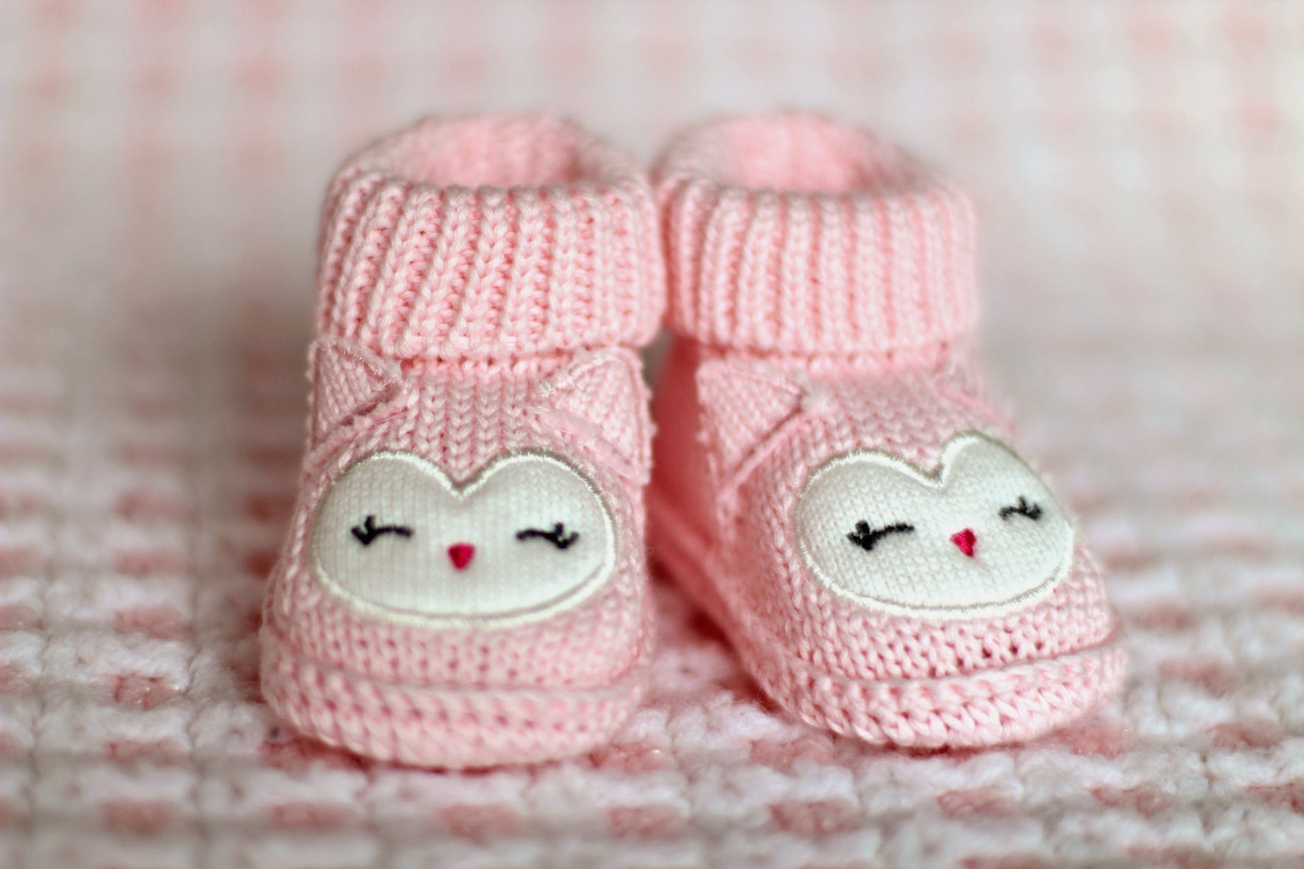 close up of pink baby booties